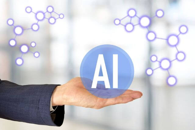 Eine Hand und Moleküle als Sinnbild für KI-Technologie